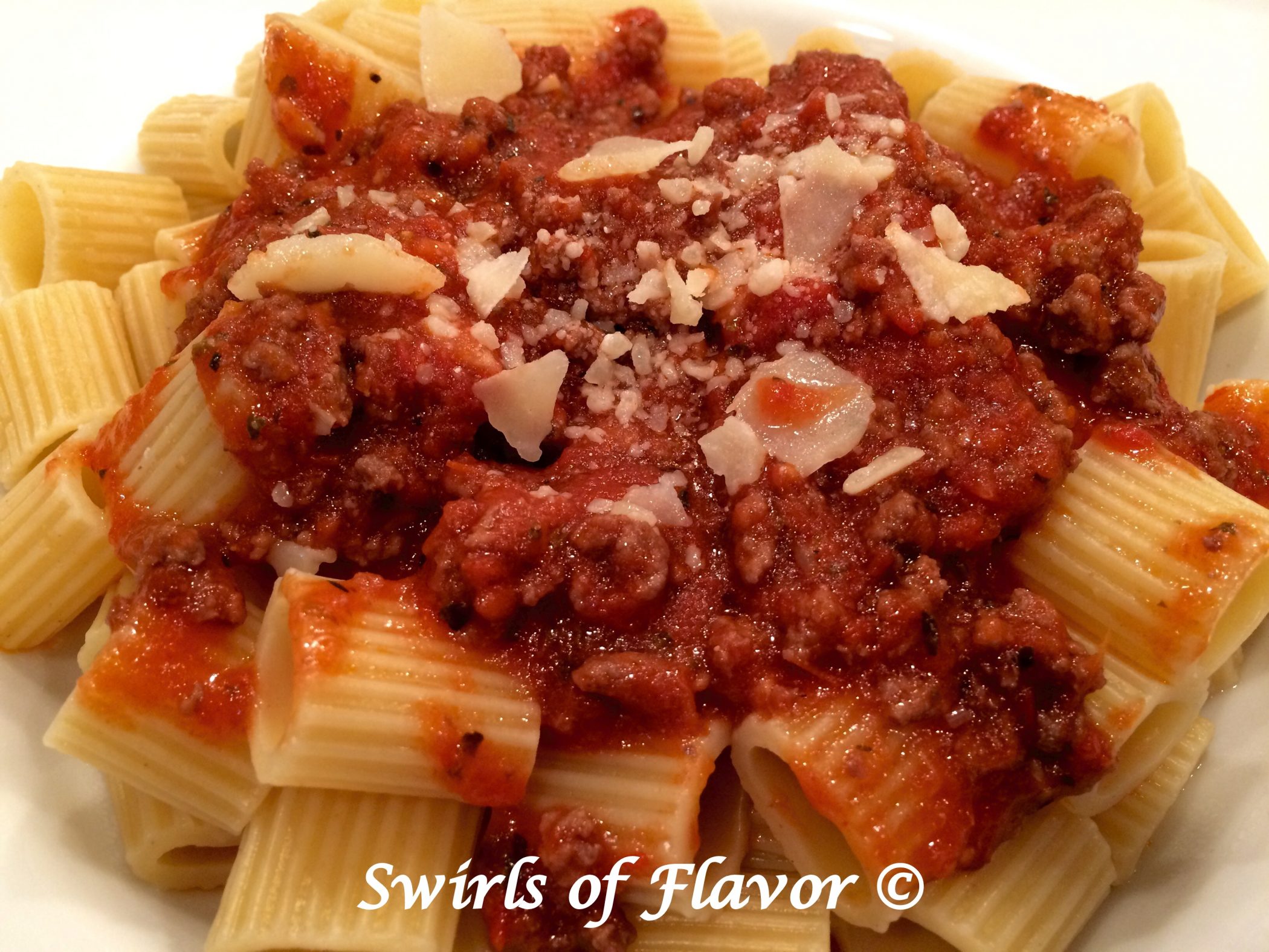 meat sauce with pasta and cheese