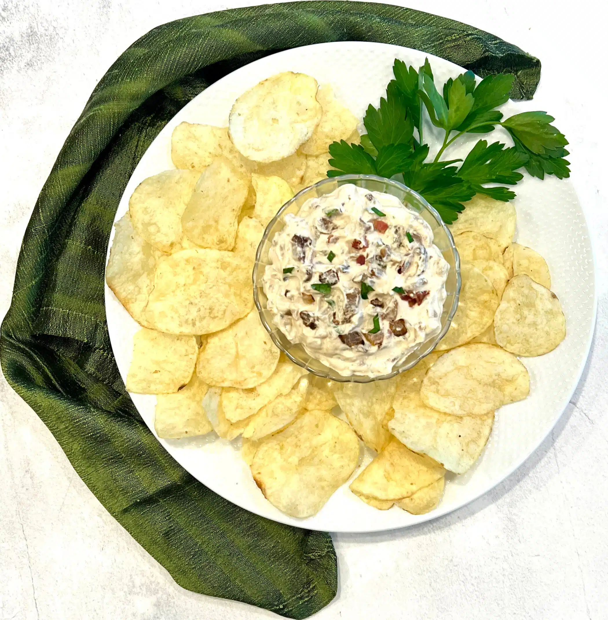caramelized onion dip in a bowl with potato chips
