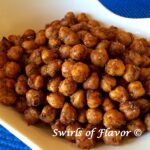 crispy chickpeas with chili seasoning in white bowl
