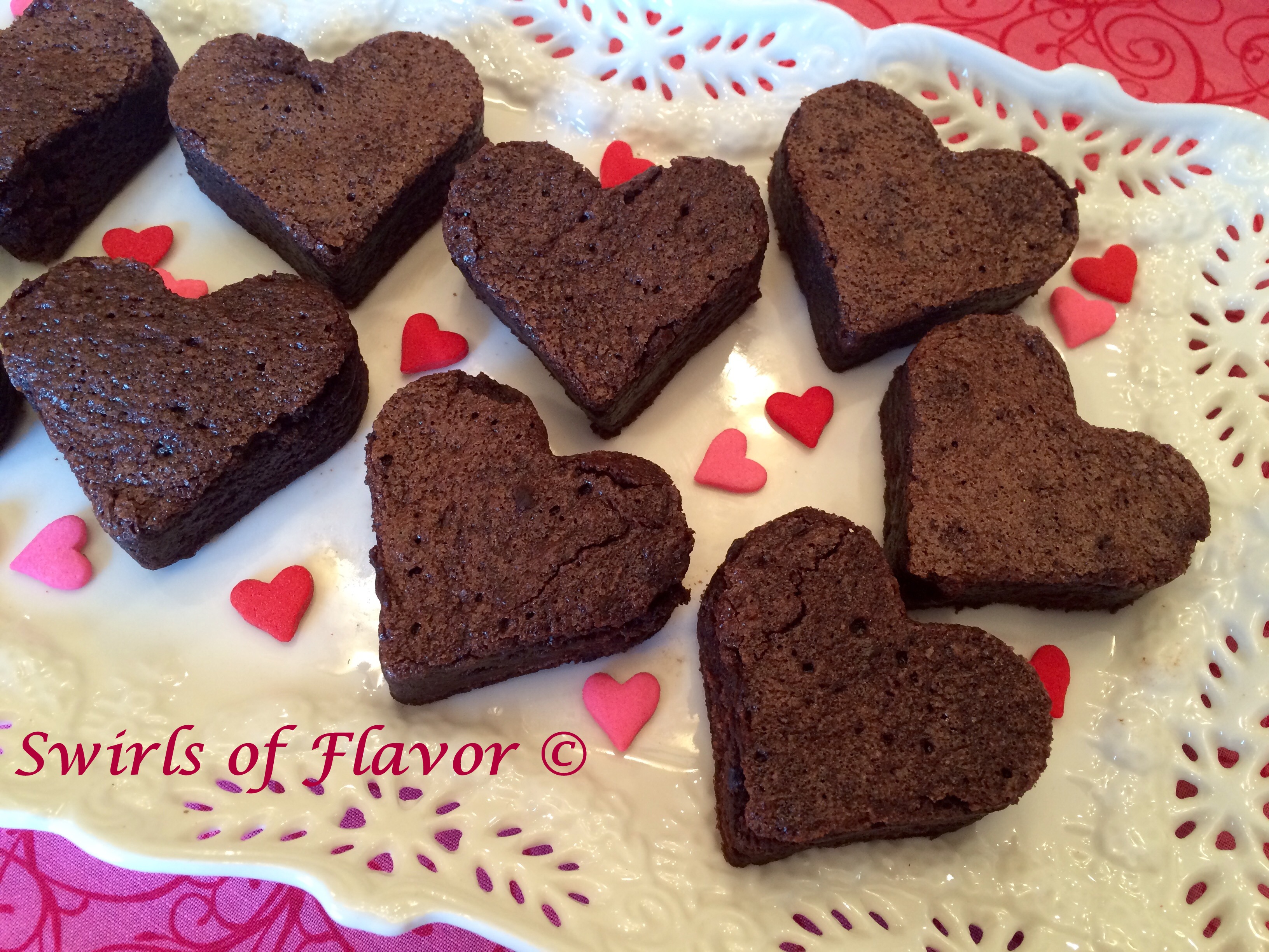 Homemade heart shaped brownies recipe on a white platter