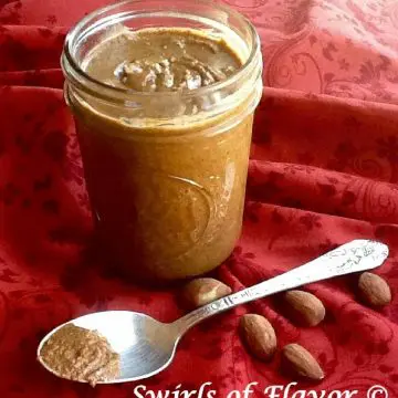 homemade almond butter in mason jar with a spoon
