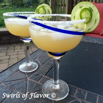 two glasses of margaritas with cucumber and jalapeno