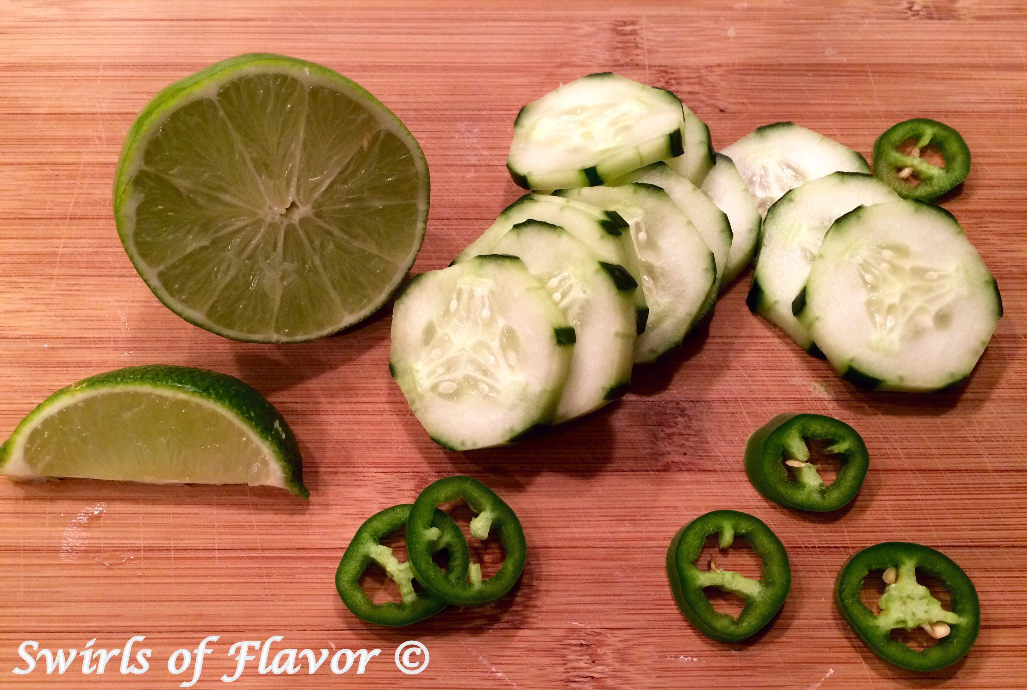Cucumber, jalapeno and lime ingredients for Jalapeno Cucumber Margaritas recipe.