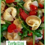 Cheese Tortellini with arugula and tomatoes