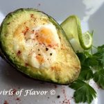Baked Egg In Avocado combines the perfect protein with a healthy fat creating a powerhouse of nutrition for breakfast! #nationaleggday | easy recipe | breakfast | avocado | egg | baked egg | healthy | #swirlsofflavor
