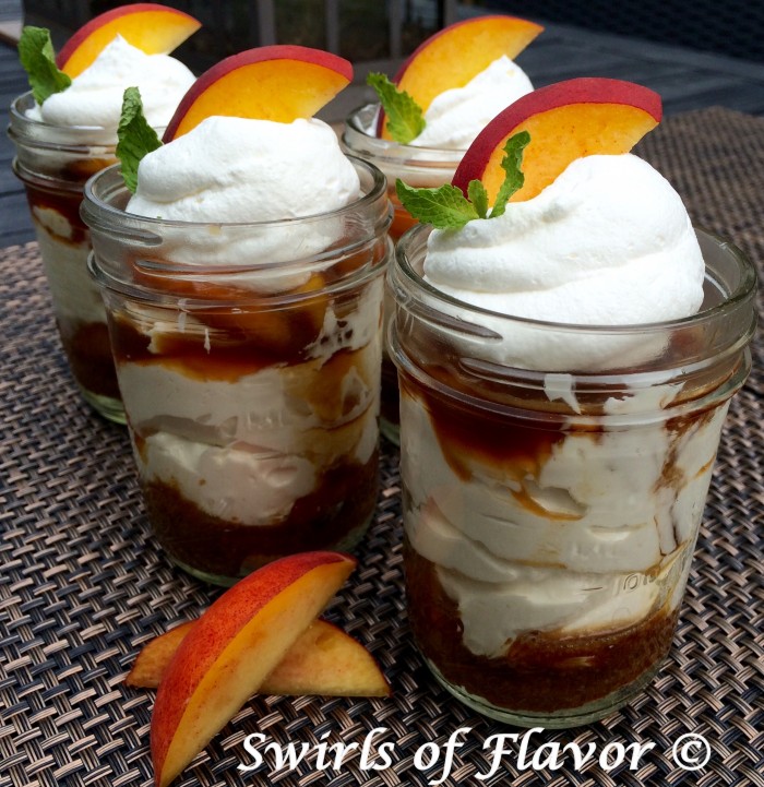Bourbon Peach Cheesecake Mousse in a Jar has a pecan graham crust and Bourbon peaches with a no-bake cheesecake mousse, giving it a southern flair. an easy to make summer dessert recipe, this award winning recipe will be a winner on your table too! peach | summer | fruit | no bake | dessert | cheesecake | mason jar | easy recipe | award winning | #swirlsofflavor