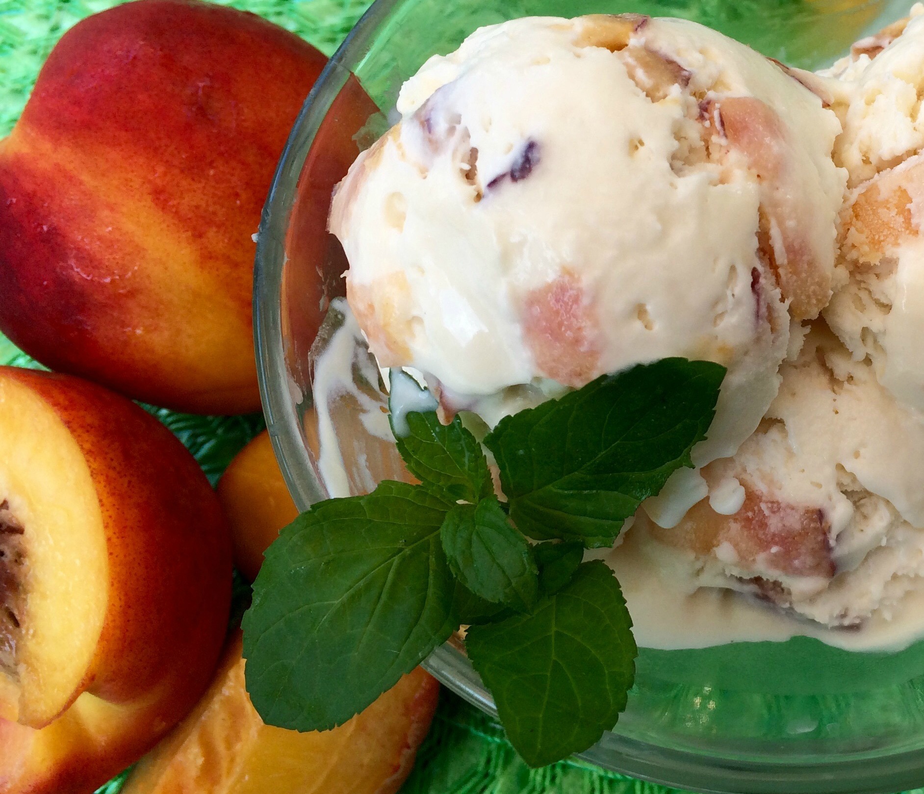Peach Ice Cream with fresh peaches and mint sprig
