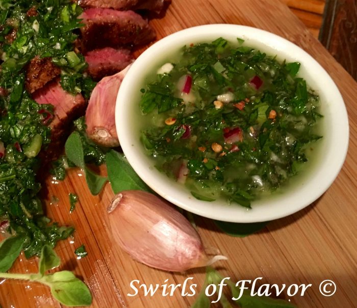 Quick and easy to make, Chimichurri Sauce is garlicky, herby, spicy and tangy all at the same time! Guaranteed to be your new fresh herb sauce of the summer! herbs | herb sauce | fresh herbs | Argentinean herb sauce | sauce for steaks