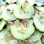 Cucumber Salad combines the crunch of fresh cucumbers with a light and tangy homemade vinaigrette and a hint of red onion making it the perfect side dish recipe on a warm summer evening.