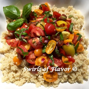 Heirloom Tomato Bruschetta Quinoa is an easy summer recipe with a bruschetta topping of heirloom tomatoes, red onion, fresh basil, olive oil and white balsamic vinegar and over a bowl of the super grain quinoa.