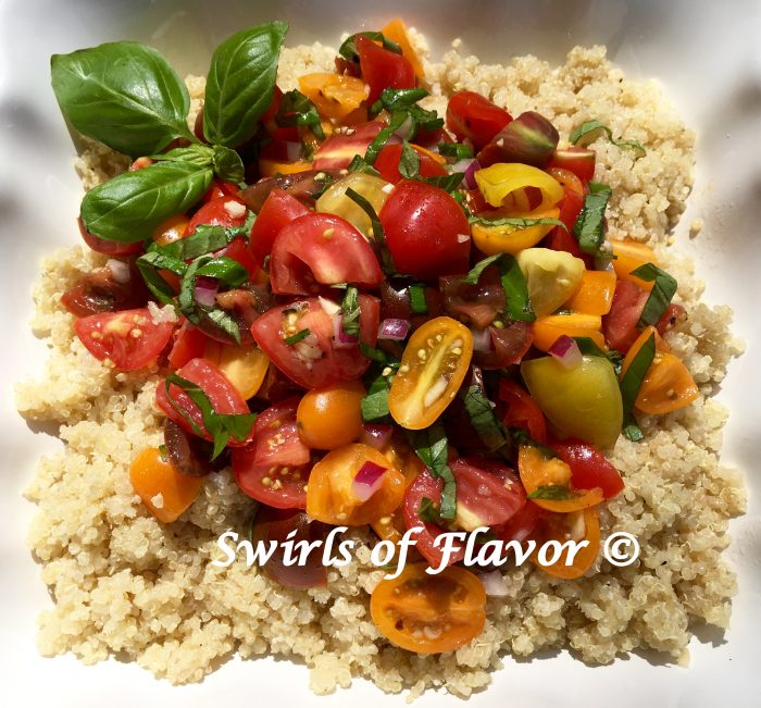 Heirloom Tomato Bruschetta Quinoa is an easy summer recipe with a bruschetta topping of heirloom tomatoes, red onion, fresh basil, olive oil and white balsamic vinegar and over a bowl of the super grain quinoa. easy recipe | side dish | summer | farmers market | heirloom tomatoes | quinoa | meatless Monday | entertaining | #swirlsofflavor