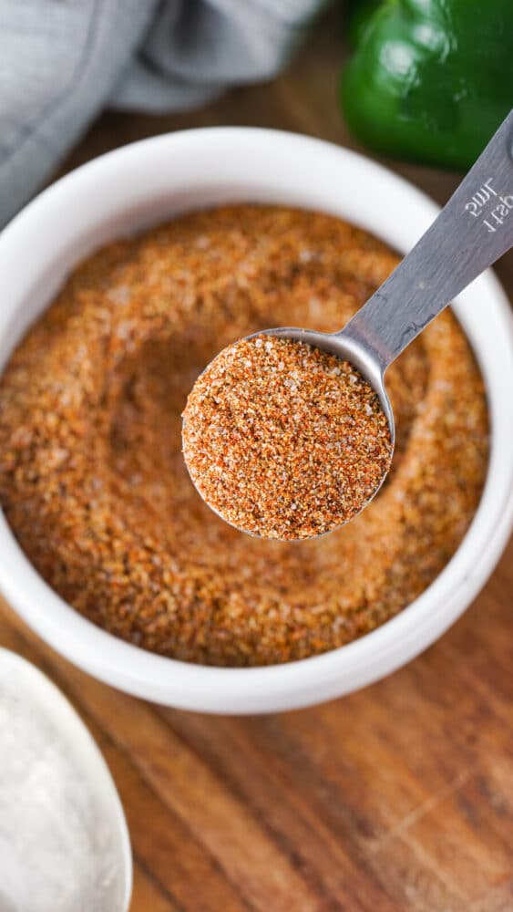 taco seasoning in measuring spoon and bowl