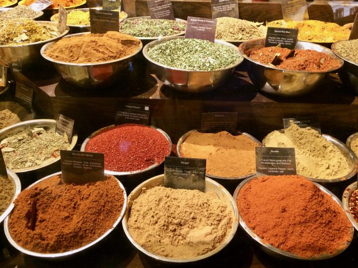 lots of colorful spices in bowls