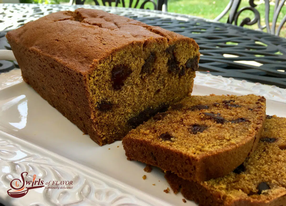 chocolate chip pumpkin bread with slices on white plate