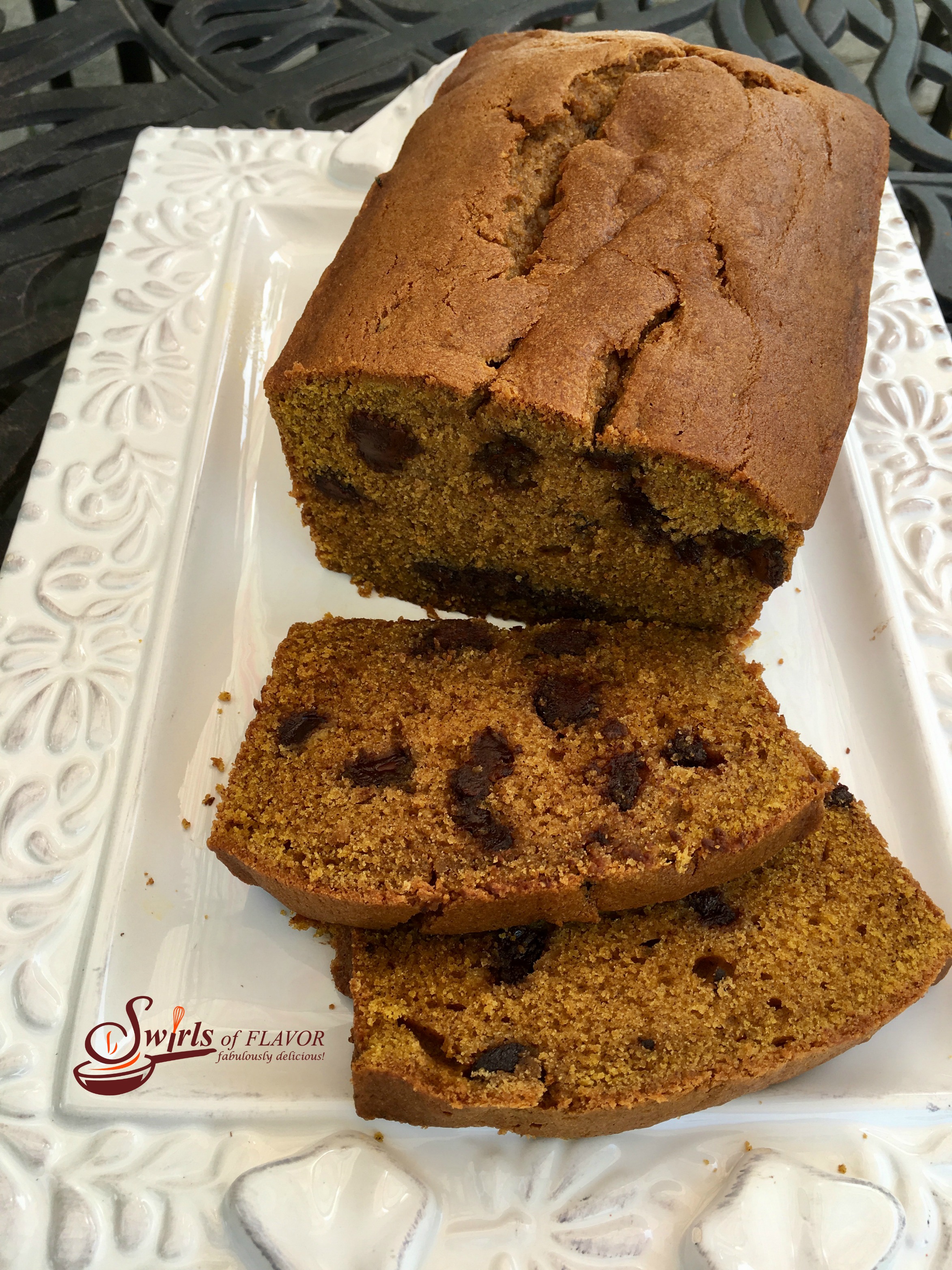Chocolate Chip Pumpkin Loaf with slices on white plate