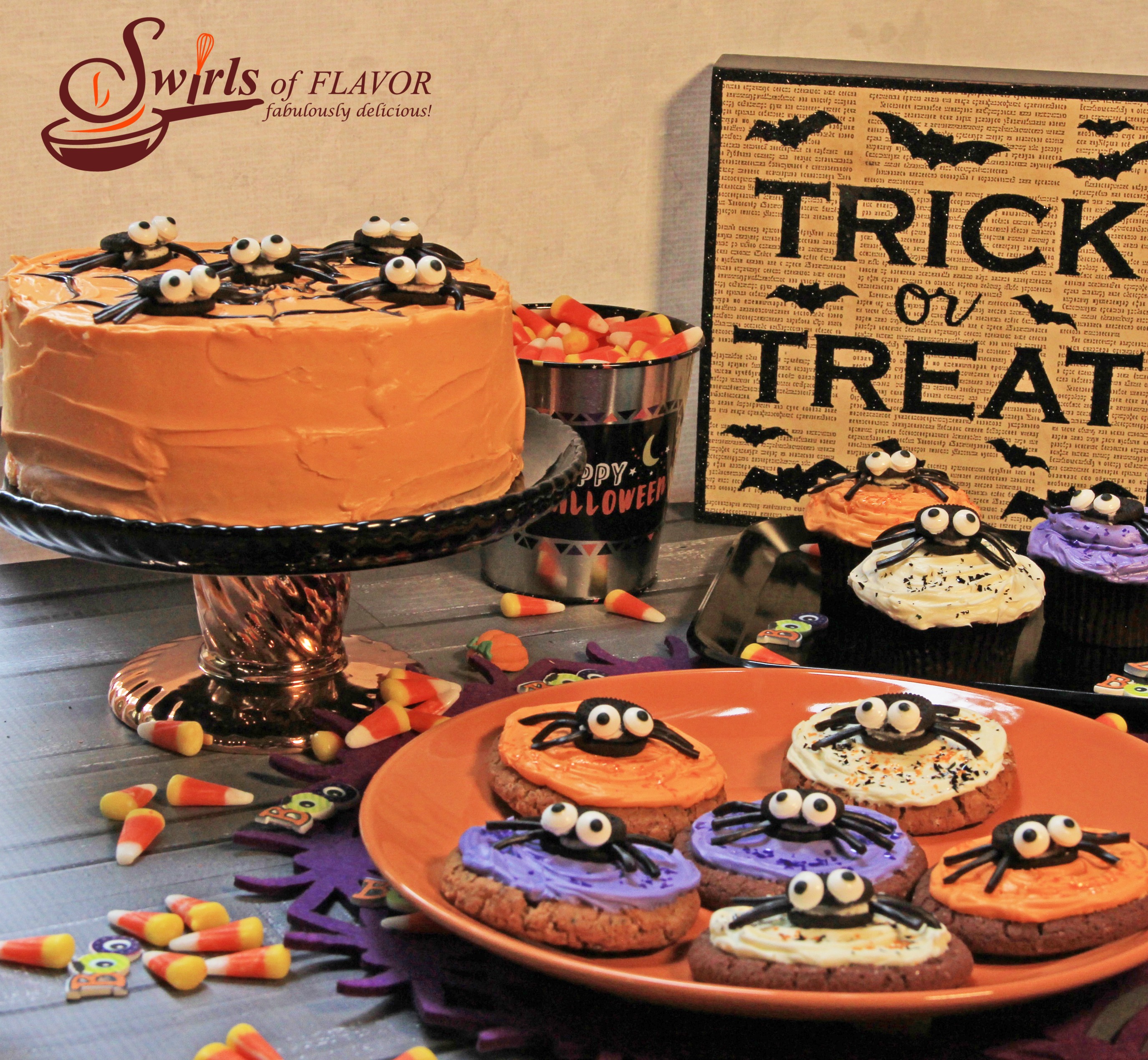 Spider cookies, spider cupcakes and spider cake with trick or treat sign