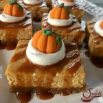 Salted Caramel Pumpkin Spice Cheesecake Bars is an easy way to make a cheesecake recipe without all the fuss. Every bite of these creamy cheesecake bars recipe is kissed by the warm holiday flavor of pumpkin pie spice and buttery cinnamon graham crust! And it's such an easy recipe to make and will impress your guests too! #pumpkinspice #pumpkincheesecake #cheesecakebars #easyrecipe #dessert #easydessert #holiday #saltedcaramel #pumpkincheesecakebars #pumpkinpuree #pumpkinpiespice #swirlsofflavor