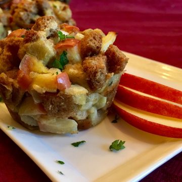 apple sage stuffing muffin on platter with apple slices