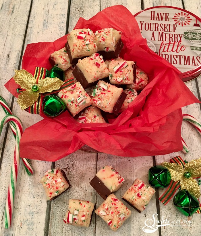 Candy Cane Fudge is the perfect holiday dessert for gift-giving and serving! A rich chocolate layer is topped with candy cane studded white chocolate making this an easy to make dessert and the perfect foodie gift! #fudge #homemade #homemadefudge #candycane #peppermint #easyrecipe #Christmas #foodgift #swirlsofflavor