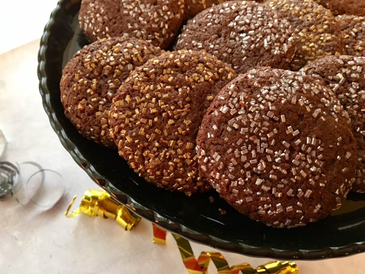 close up of silver and gold chocolate cookies on a plate