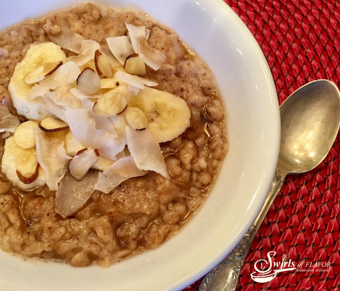 Slow Cooker Banana Coconut Oatmeal cooks while you sleep! Wake up to a nutritious breakfast that's easy to make and full of nutrition! banana | coconut | slow cooker | easy recipe | breakfast | overnight cooking | crockpot | steel cut oatmeal | #swirlsofflavor