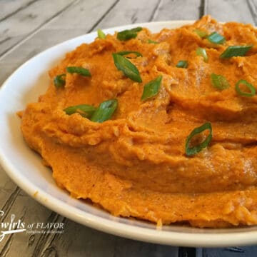 bowl of spiced sweet potatoes with scallions