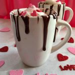 Fudgy Chocolate Mug Cake is a warm chocolate cake with bits of mini chocolate chips throughout that microwaves into a divine dessert that's sure to impress your special valentine!. #chocolate #dessert #Mug Cake #Valentine's Day #single serving #easy recipe #chocolate chips #microwave #swirlsofflavor