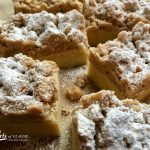 Every bite of Best Ever Crumb Cake is heavenly when a rich vanilla-scented cake is topped with buttery cinnamon crumbs dusted with powdered sugar. All it takes are simple basic ingredients from your fridge and pantry for this easy recipe that's perfect for brunch, breakfast and dessert! #easyrecipe #baking #fromscratch #homemade #crumbcake #brunch #breakfast #dessert #coffeecake #swirlsofflavor #holiday #entertaining
