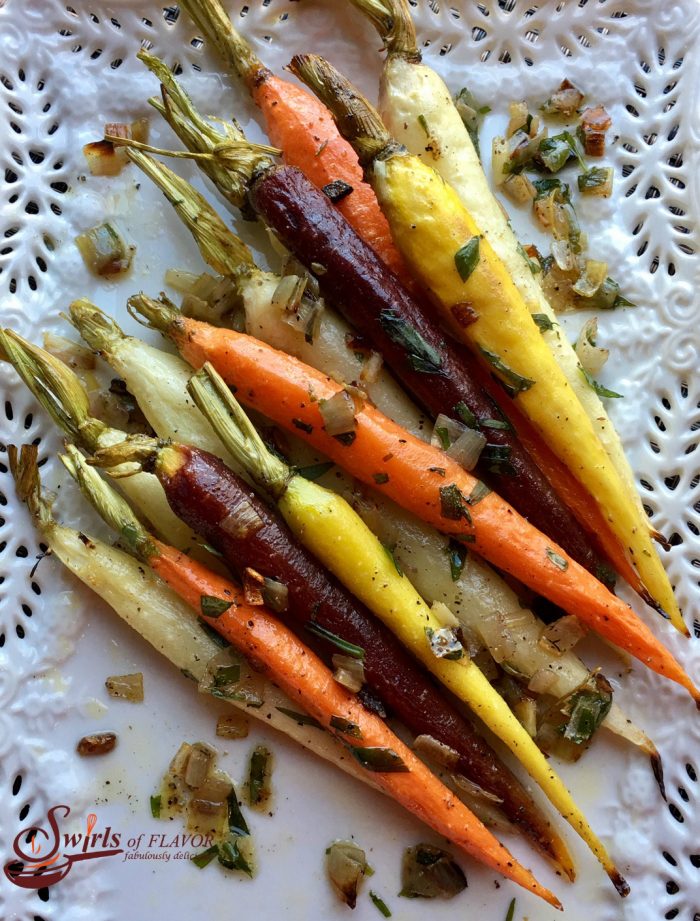 Roasted Tri-Colored Tarragon Carrots roast into sweet tenderness in just twenty minutes. Finish with a toss of creamy butter and the perfect hint of fresh anise flavor for a bowlful of nutrition, beauty, elegance and heavenly flavor! carrots | roasted carrots | roasted vegetables | tri-colored carrots | tarragon | Easter | side dish | vegetable side dish