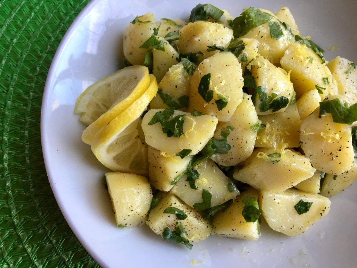 lemon parlsey potatoes in a white bowl