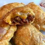 Cheeseburger Empanadas are an easy appetizer recipe bursting with a ground beef, ketchup and cheese filling. Every bite is filled with the flavors of a cheeseburger making Cheeseburger Empanadas the perfect kid friendly snack too!  #cheeseburger #funforkids #gamedayfood #empanadas #groundbeef #cheese #kidfriendly #snack #appetizer #CincodeMayo #easyrecipe #ovenbaked |#swirlsofflavor