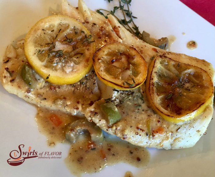 Lemon Dijon Cod Saute is a quick and easy recipe with a creamy sauce with olives and shallots, topped with sweet and tangy caramelized lemon slices! cod | fish | sauteed fish | Dijon | lemon | thyme | olives | easy dinner