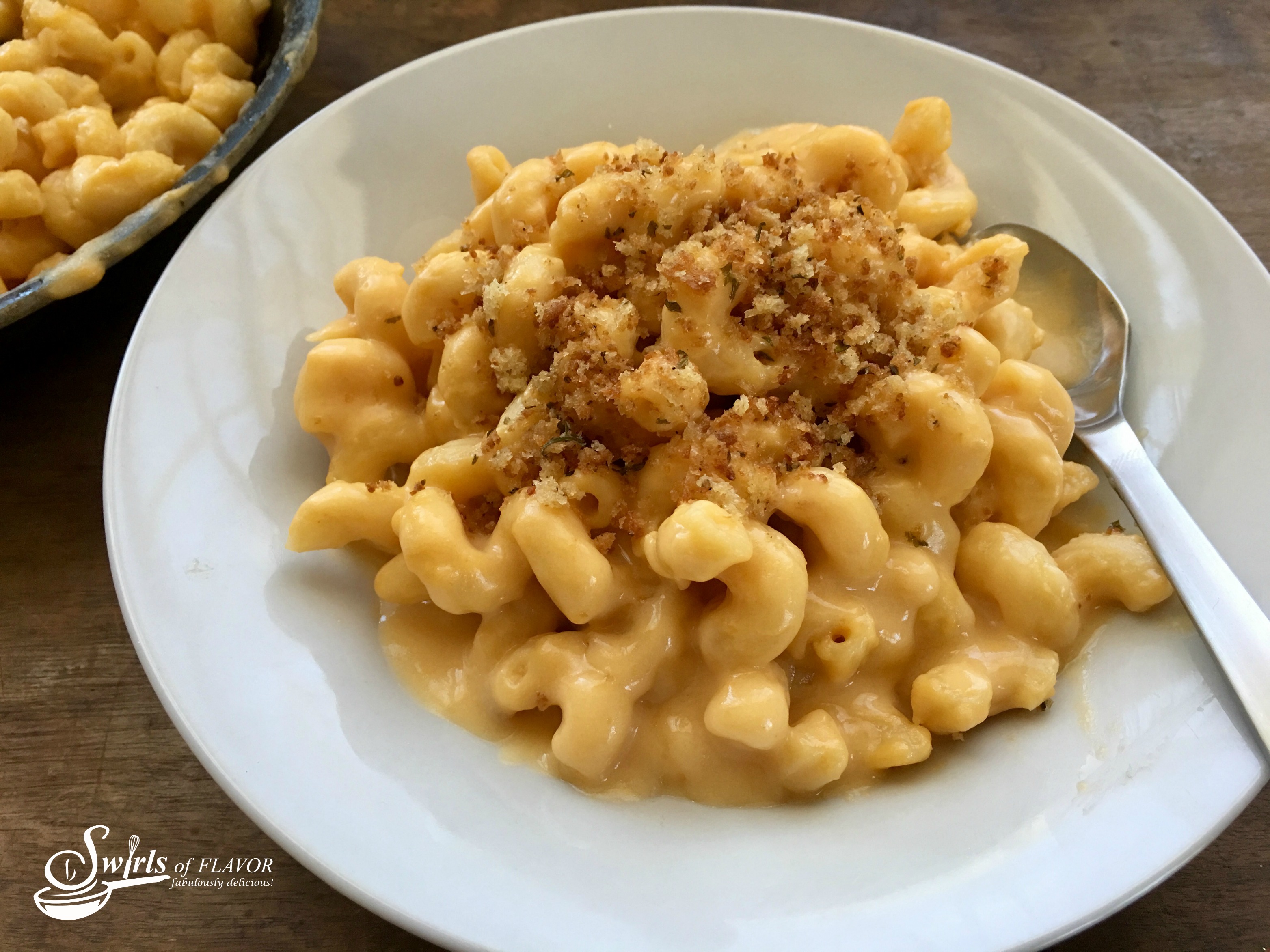 One Pot Mac 'N Cheese is an easy recipe for a busy weeknight dinner. Homemade mac and cheese is so easy to make when the pasta, cheesy sauce and breadcrumb topping are all cooked together in the same skillet! #easyrecipe #dinner #macandcheese #homemade #homemademacandcheese #onepot #onepotmacand cheese #funforkids #famiyfavorite #meatlessmonday #pasta #swirlsofflavor