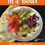 Spring roll bowl in a white dish with green print napkin and text overlay