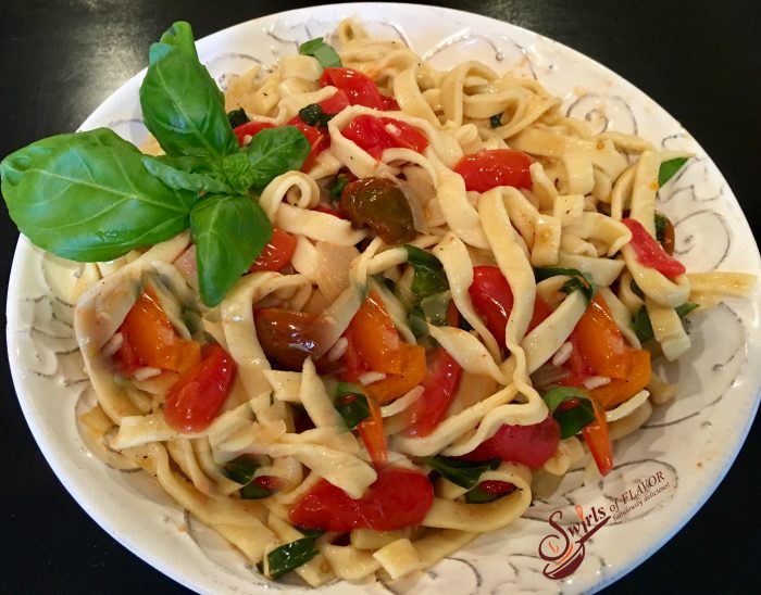 Fettuccine & Buttery Fresh Basil Tomato Sauce! Tender homemade pasta coated in a buttery white wine sauce seasoned with flecks of fresh basil and juicy perfectly wilted heirloom tomatoes! farmers market | heirloom tomatoes | fresh basil | white wine | butter sauce | homemade pasta