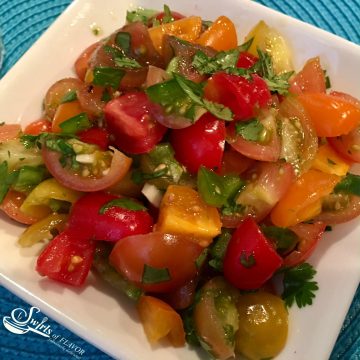 Fresh Heirloom Tomato Salsa is an easy homemade salsa recipe bursting with fresh summertime flavors and perfect with tortilla chips or tacos and over chicken, beef or fish! taco | fish | summer recipe | farmers market | heirloom tomatoes | easy recipe | salsa | Homemade | #swirlsofflavor