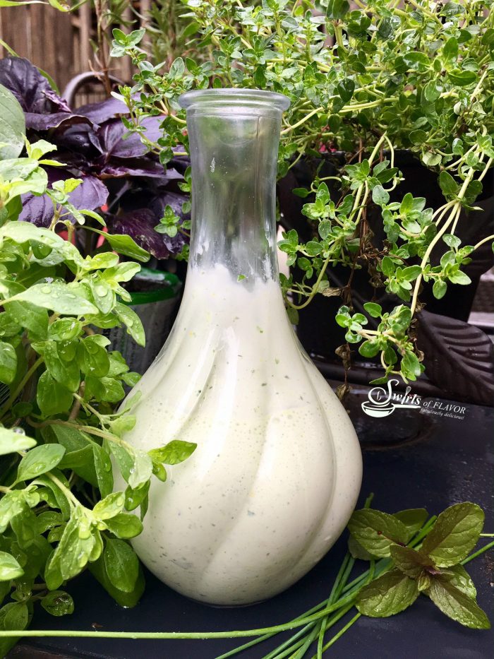 Savor the taste of summer tonight with the light creaminess of a homemade Green Goddess Salad Dressing kissed with the summertime flavors of fresh herbs! #saladdressing #creamysaladdressing #mayonnaise #Greekyogurt #freshherbs #GreenGoddess #homemadesaladdressing #easyrecipe #summerrecipe #swirlsofflavor