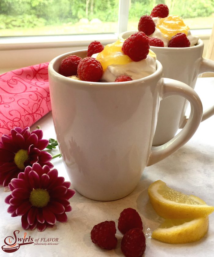Raspberry Lemon Mug Cake, "baked" in the microwave, topped with whipped topping, lemon curd and fresh raspberries, will show mom just how much you love her.  mug cake | Mother's Day | raspberry | lemon | no-bake | raspberry lemon