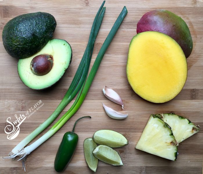 Mango and pineapple flavors will transport you to the tropics as you savor scoops of Sweet 'N Spicy Tropical Guacamole! avocado | pineapple | mango | guacamole | jalapeno }Cinco de Mayo | appetizer | snacks