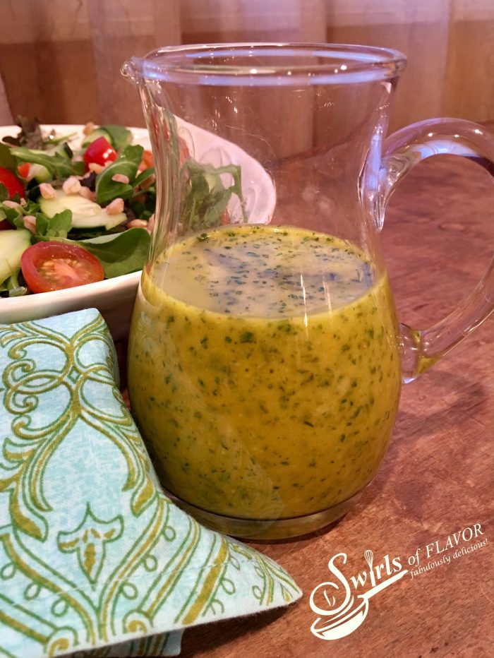 Turmeric Cilantro Vinaigrette is a homemade salad dressing that combines the flavors of the powerful and amazing turmeric along with cilantro and fresh ginger making it a fabulous vinaigrette that's perfect on salads, chicken, fish, vegetables and pasta. #turmeric #homemadevinaigrette #homemadesaladdressing #saladdressing #easyrecipe #salad #swirlsofflavor
