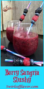 A bottle of sangria and your favorite frozen berries are all it takes to whirl up your favorite childhood summertime beverage with an adult twist! Berry Sangria Slushy for the kid in you! slushy | wine | sangria | berry | frozen | drinks | cocktails | barbecue | entertaining July Fourth