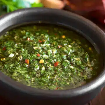 homemade chimichurri sauce on a black bowl