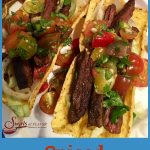 Seasoned slices of juicy skirt steak are nestled in a crunchy corn shell and topped with a lime-scented fresh heirloom tomato salsa. #tacos #TacoTuesday #steak #tacos #CincodeMayo #grilling #freshsalsa #swirlsofflavor #easyrecipe
