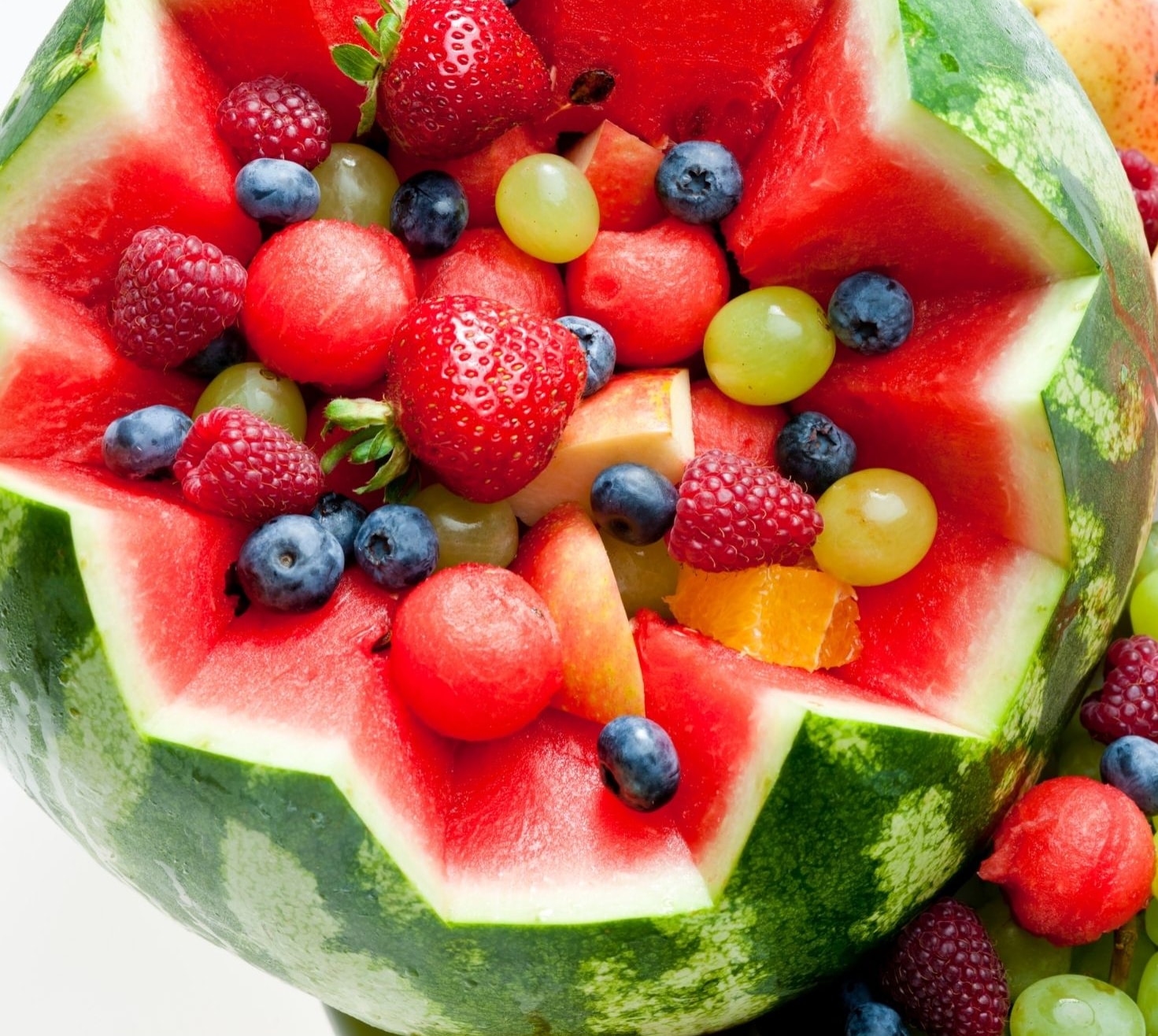 fresh fruit in a cut out watermelon