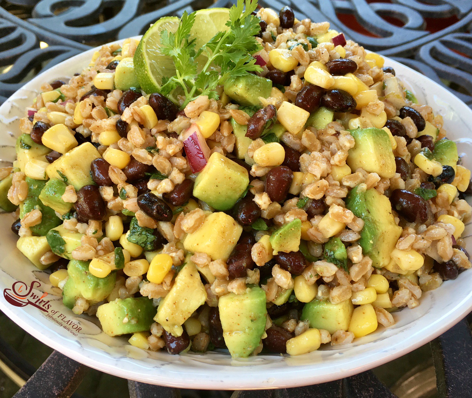A chili lime vinaigrette, the creamy goodness of avocado, protein-rich black beans and fresh corn make Chili Lime Black Bean Corn Farro Salad the perfect addition to your alfresco table this summer! salad | avocado | black beans | corn on the cob | farro | grains