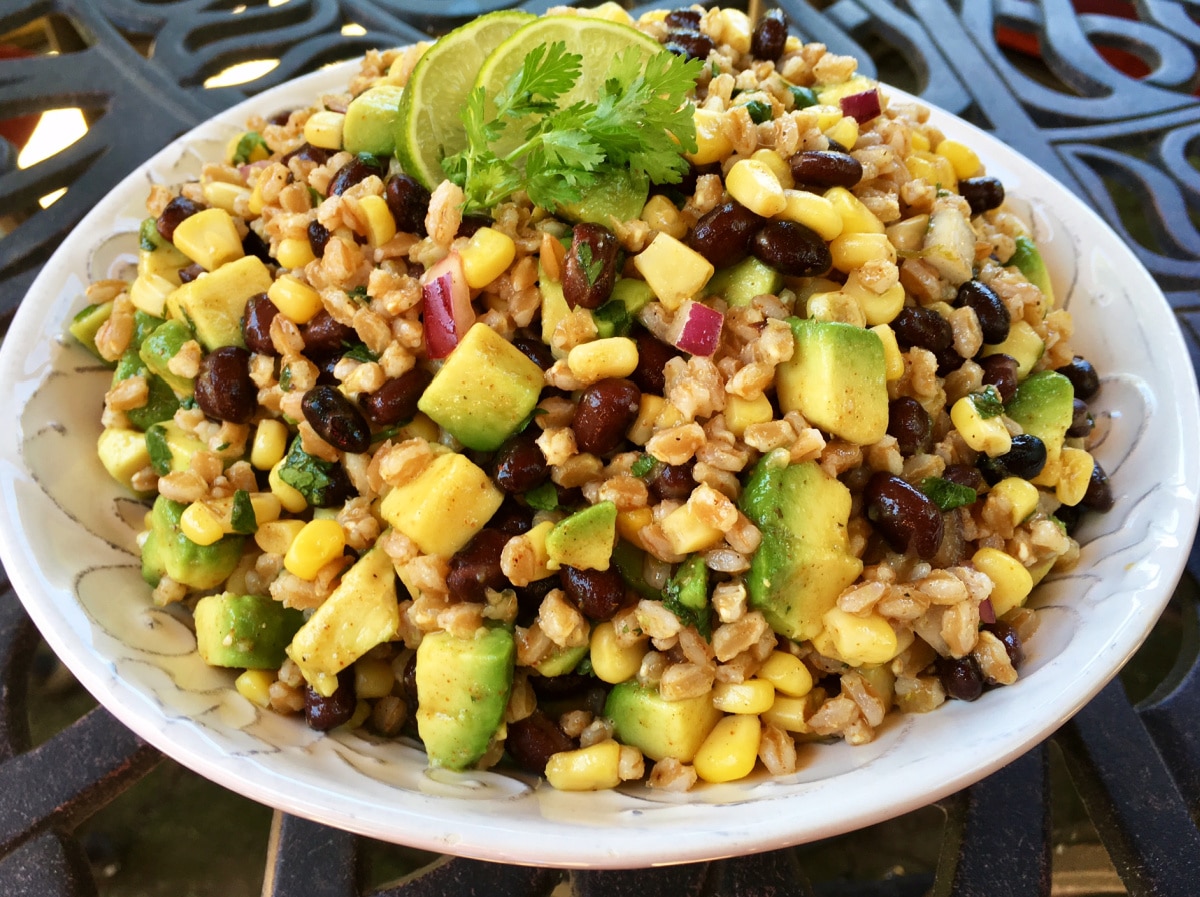 black bean farro salad in a white bowl