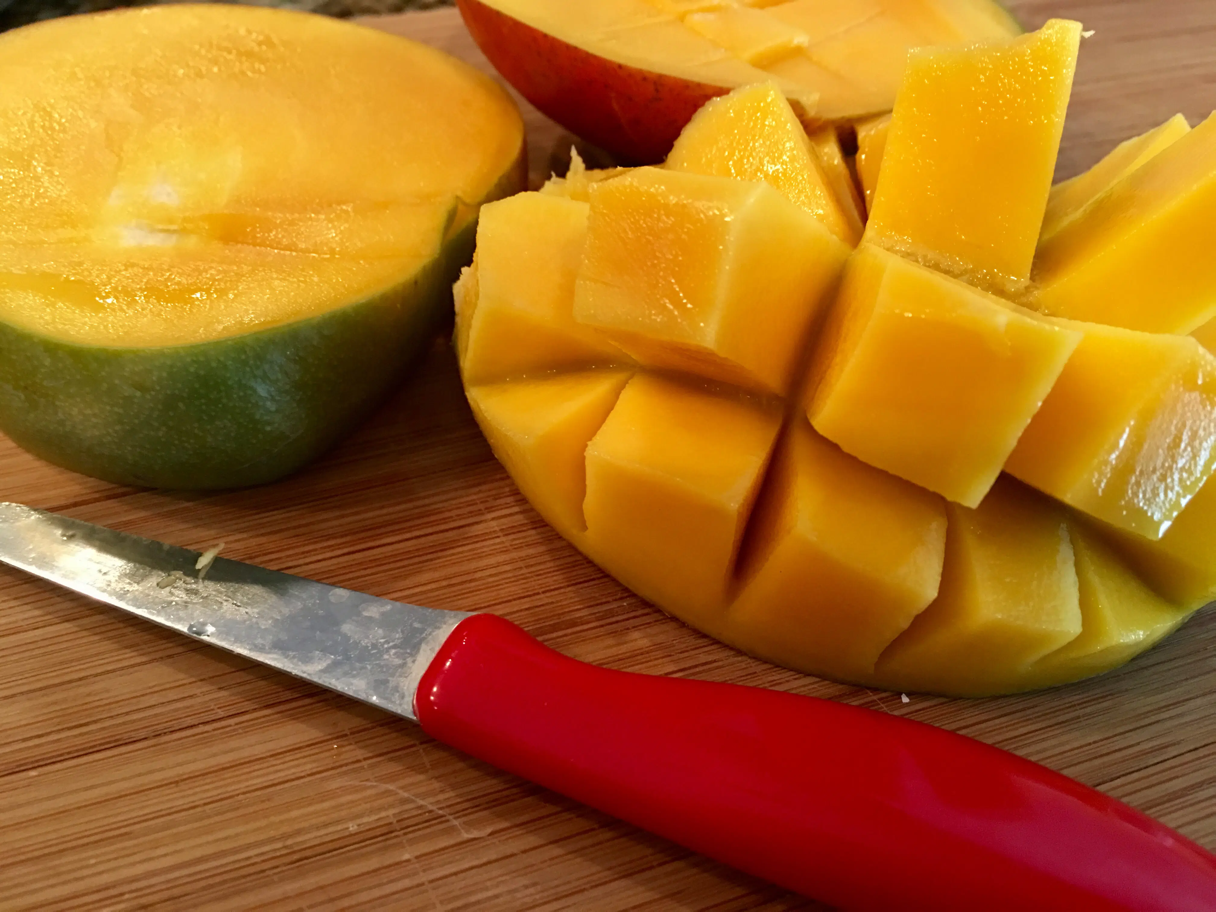 cutting a fresh mango