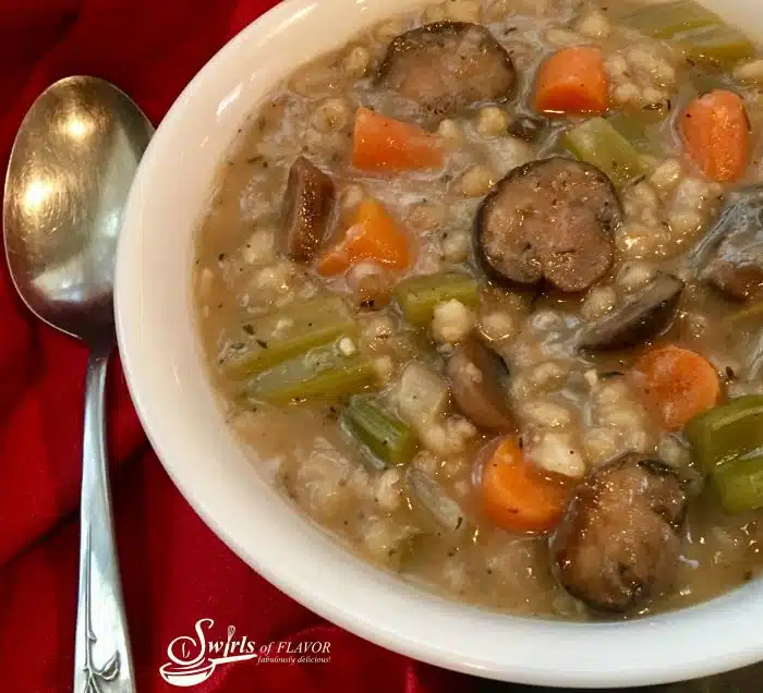 Slow Cooker Mushroom Barley Soup is bursting with tender mushrooms, carrots, celery and onions complimented by bits of barley in a perfectly seasoned broth. soup | slow cooker | crockpot | mushroom | barley | vegetable | dinner