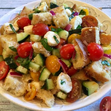 Panzanella is an easy recipe for the classic Tuscan bread salad and is bursting with heirloom tomatoes, cucumber, mozzarella and fresh basil, the flavors and colors of summer!