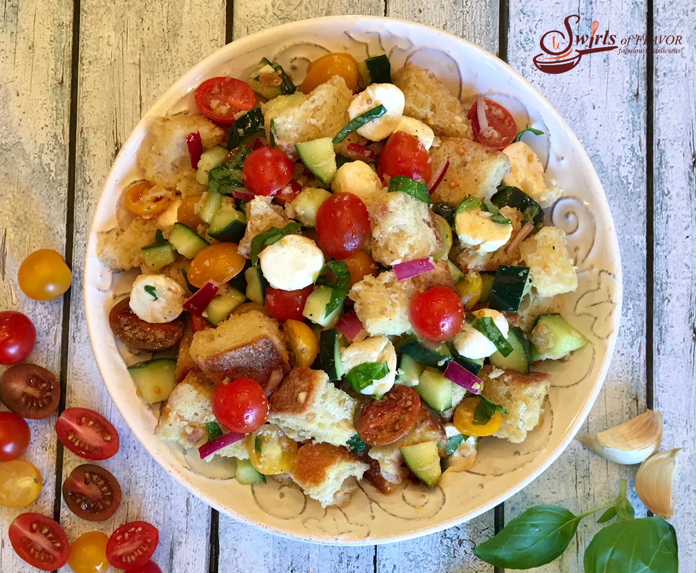 Panzanella is an easy recipe for the classic Tuscan bread salad and is bursting with heirloom tomatoes, cucumber, mozzarella and fresh basil, the flavors and colors of summer!